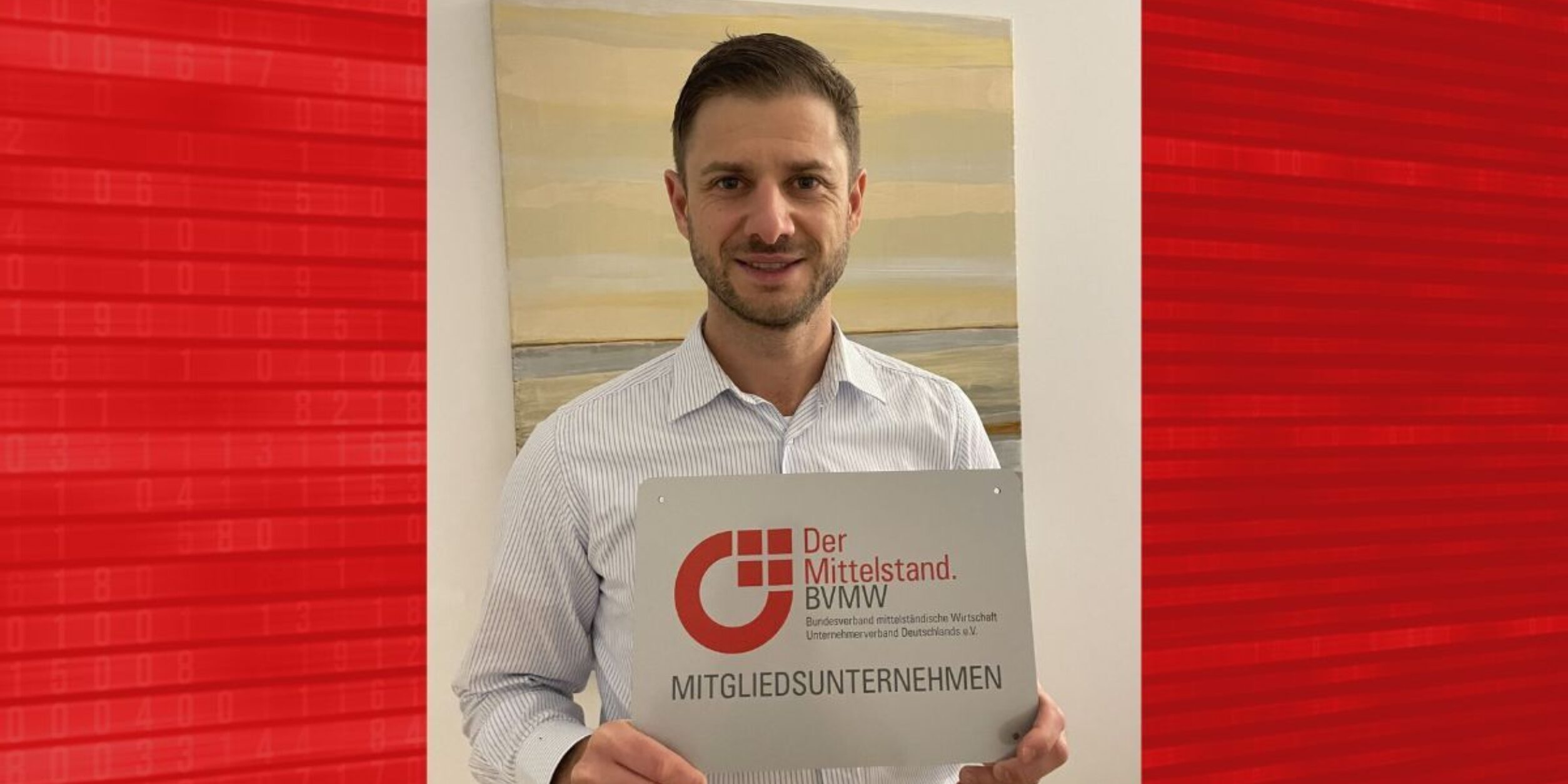 Dr. Ferstl mit BVMW Mitgliedsplakette