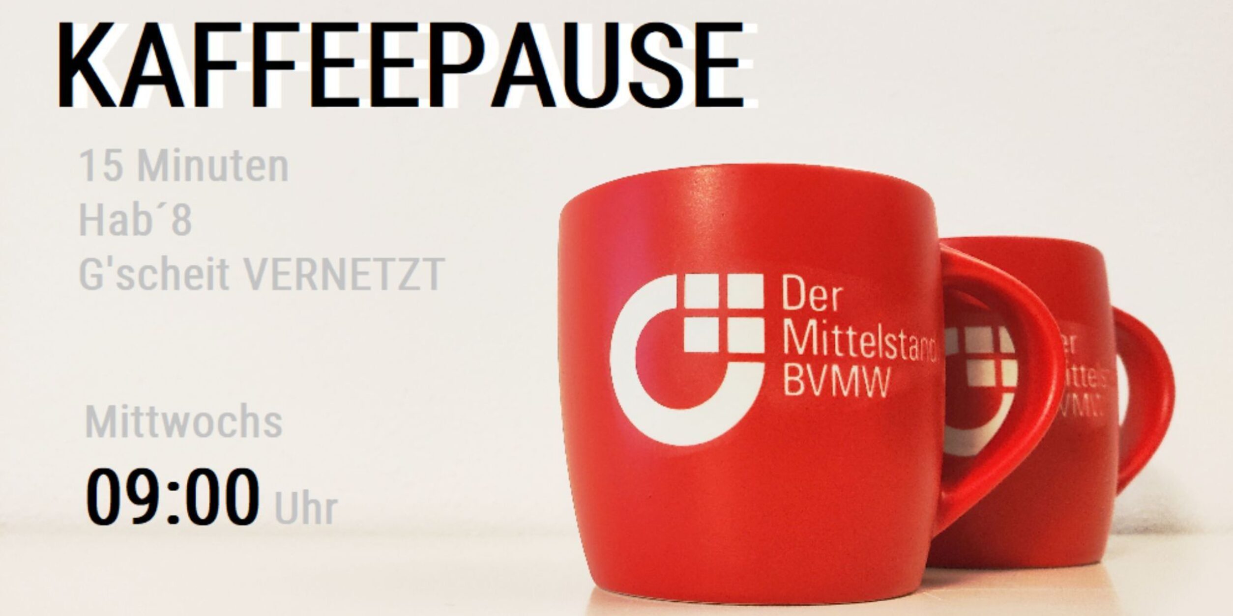 Kaffeepause, zwei rote Tassen mit BVMW Logo
