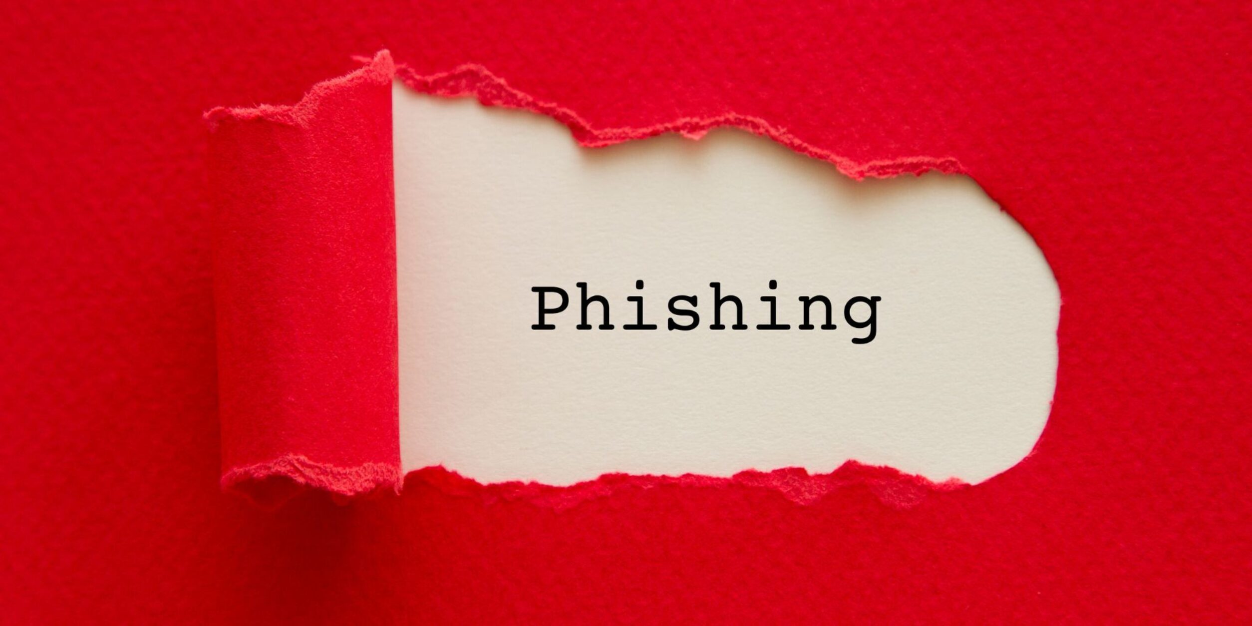 Ein Papier auf dem mit Schreibmaschine "Phishing" geschrieben steht